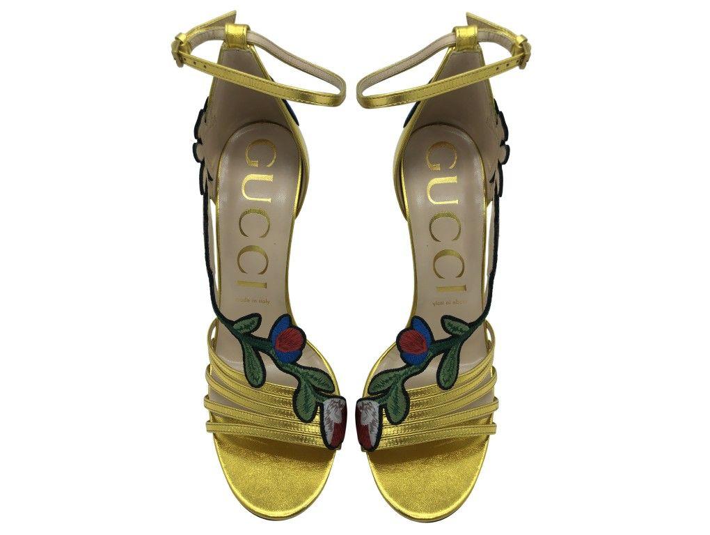 Stunning pair of Gucci Gold strappy Sandals with flower detail in a size 40 (UK 7). An unworn new pair which have been stored since purchase. Save on these as the Retail price is £670.
BRAND	
Gucci

FEATURES	
Ankle Buckle closure, Leather lining &