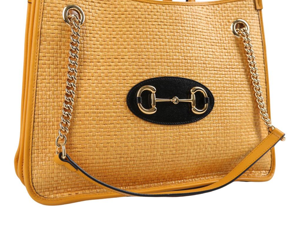 This beautiful Gucci Horsebit Raffia yellow tote bag is now available for sale. Wear as a shoulder bag, handheld or on the crook of your arm. A preloved bag in excellent condition.

BRAND	

Gucci



ACCESSORIES	

Care Booklet, Dust