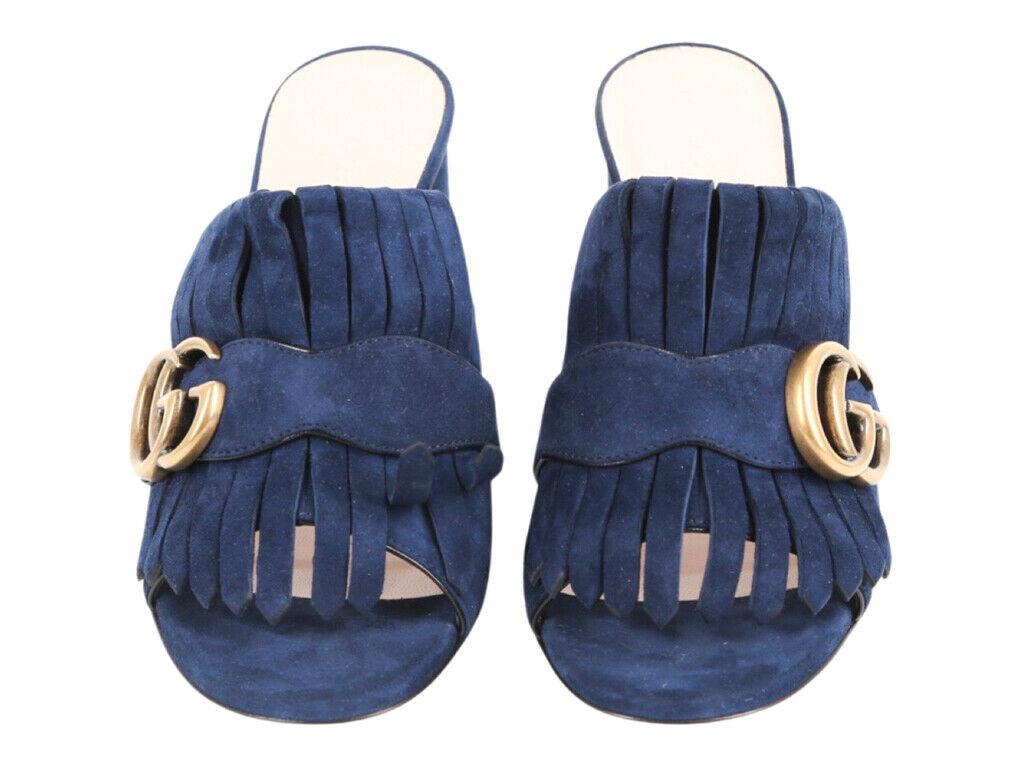 Gorgeous pair of Gucci Marmont Velvet Fringed Mules in a size 35 (UK 2). Purchased and stored, never worn.

BRAND	
Gucci

FEATURES	
(Made in Italy), GG detail, Fringe detail

MATERIAL	
Leather Upper

COLOUR	
Navy

ACCESSORIES	
Box, Dust