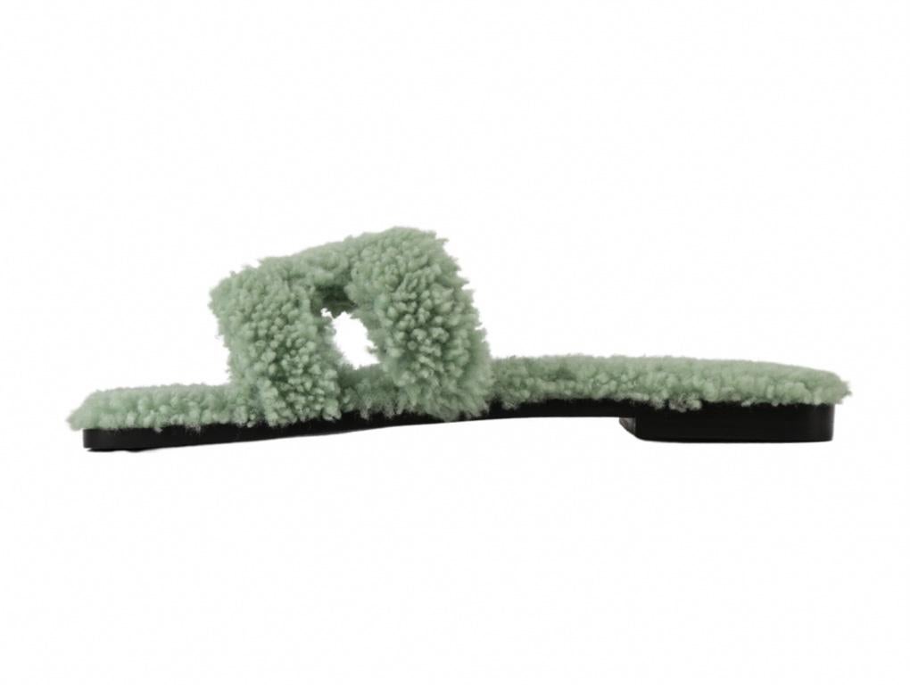 Hermès Oran Sandals with a twist..! Made from shearling wool in a beautiful mint green colour. Please note that there is light wear on the sole as they have been tried on otherwise in as new condition. These pair are in a size 38 UK 5.

Colour
Mint