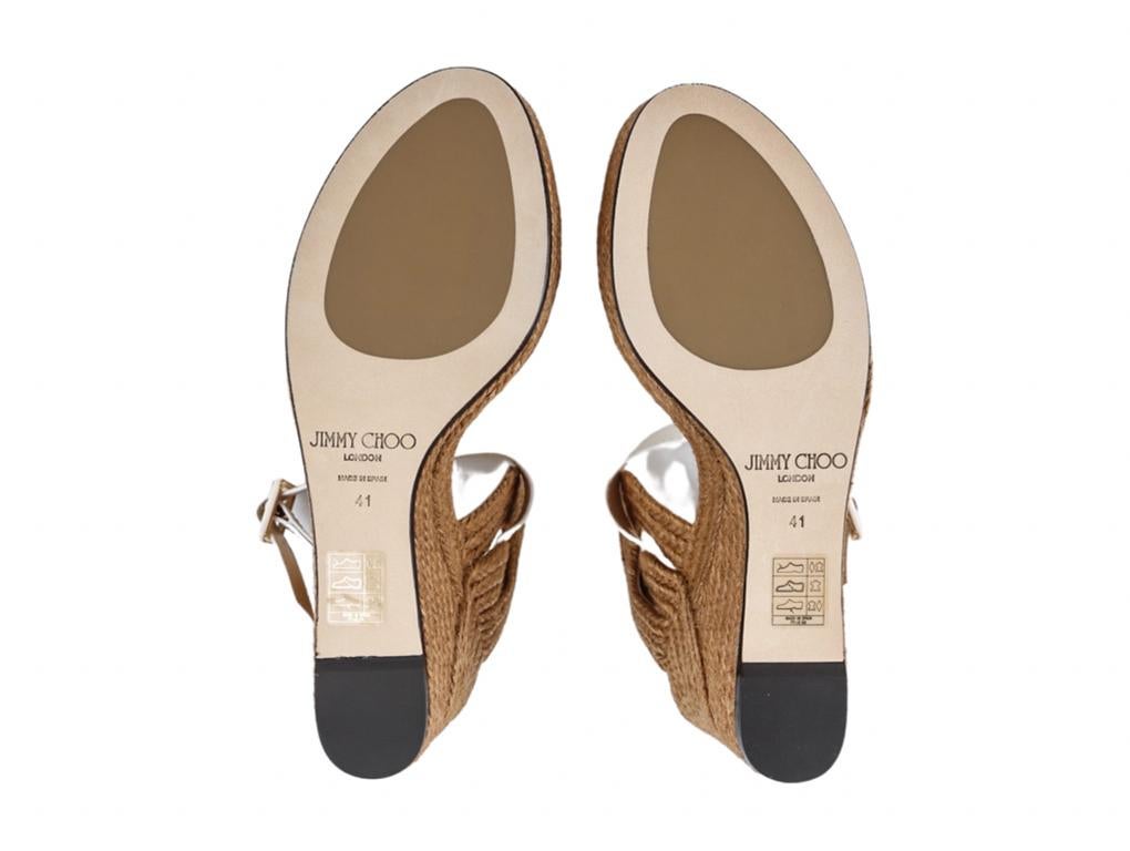 Slip into Jimmy Choo's Delphi espadrille sandals to add a Grecian touch when worn. These beautiful sandals were purchased, stored and never worn. Size 41 UK8.
Colour
White
Material
Leather, Raffia
Height / Width/ Depth
Heel 11 cm Sole height 3 cm