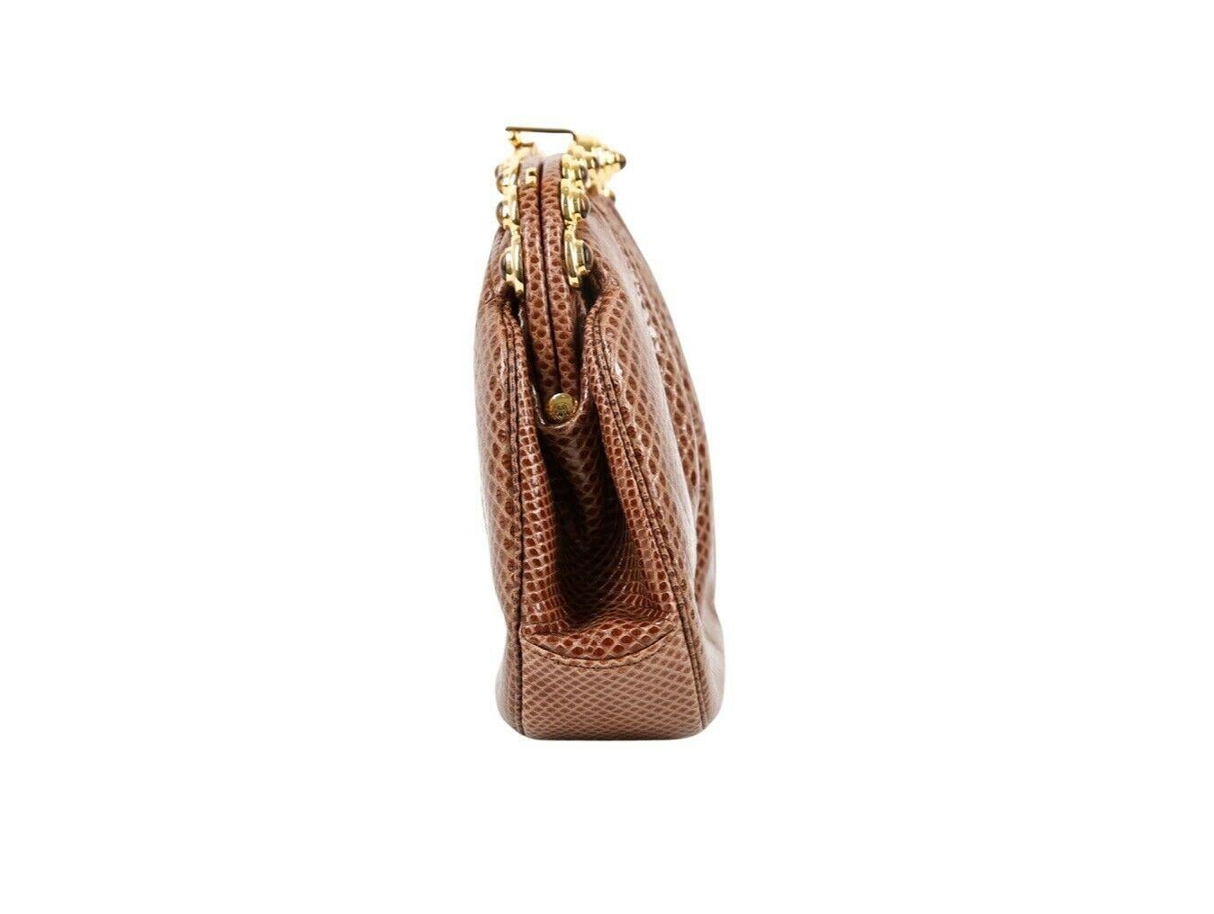 This exquisite Lizard leather bag with stone detailed opening by Judith Leiber is just breathtaking. Wear as a Cross-Body, Shoulder or Clutch bag. Truly a collector's item with lots of wear still left.

Colour
Tan
Metal