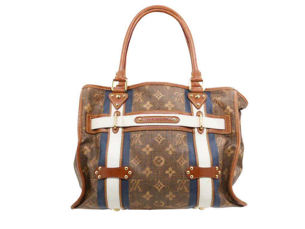 This stunning and rare Louis Vuitton Limited Edition Tisse Rayures GM Tote Bag the largest tote of the Rayures family and has fashion and functionality rolled into one. Inspired by the classic Louis Vuitton 90 Courier trunks this bag has a