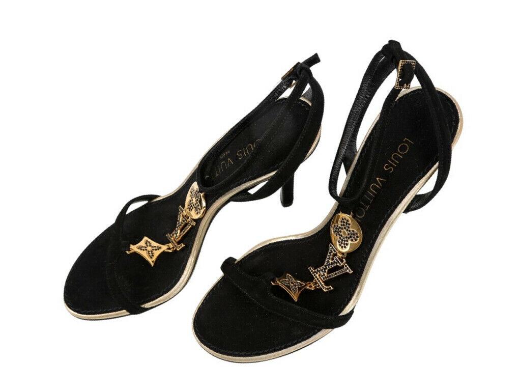 Beautiful Louis Vuitton T Bar Sandals in Black and Gold for sale. Size 36.5 and in black with the most beautiful Monogram detail on the front. These shoes are preloved and in Excellent condition.

BRAND  
Louis Vuitton

ACCESSORIES   
Dustbag,