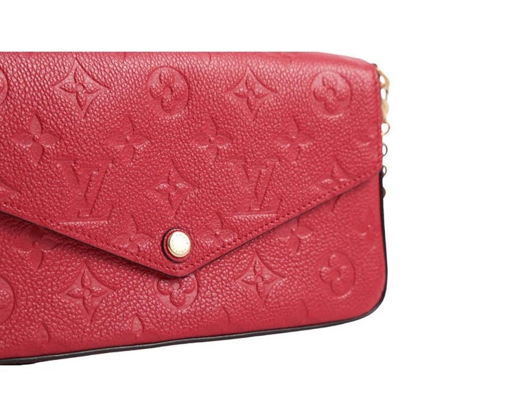 A gorgeous Pochette Felicie clutch or crossbody bag for sale by Louis Vuitton in Red Empreinte Leather. This bag does NOT include the removable zipped pocket nor the flat credit card pocket. This preloved one is in excellent condition.

BRAND	
Louis