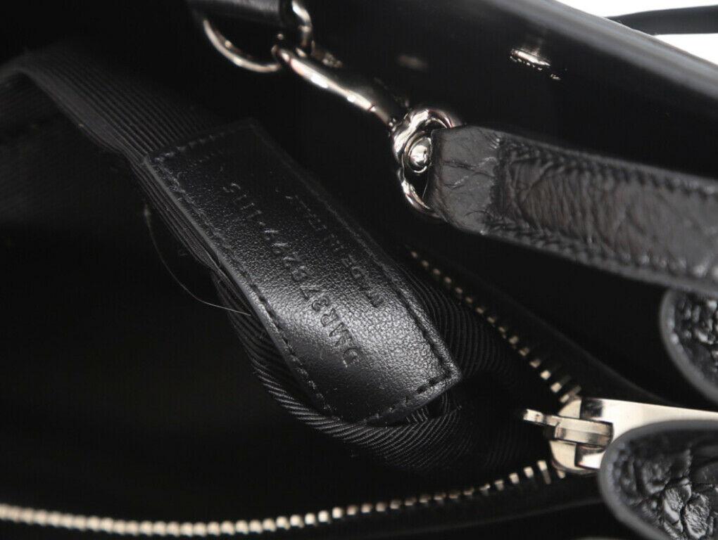 Gorgeous Small Sac De Jour bag from YSL in black faux crocodile print. A pre-loved item in excellent condition.
BRAND	
Saint Laurent, YSL

FEATURES	
attached clochette with padlock, detachable strap, Double rolled leather handles, leather swatch,