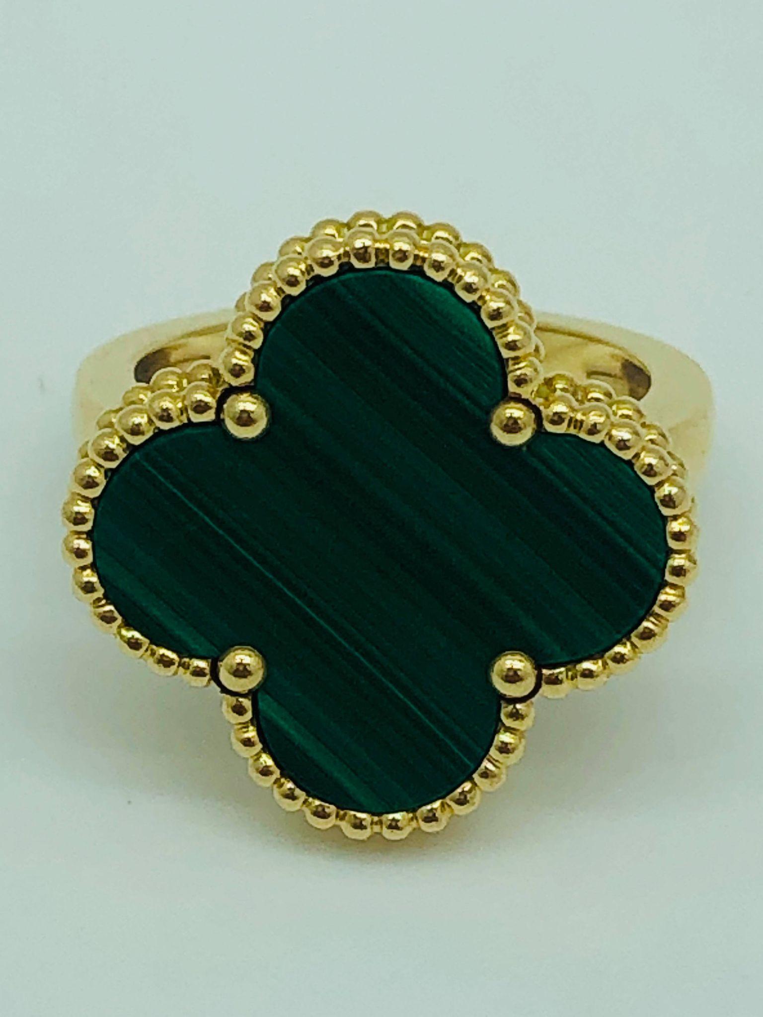 Beautiful Van Cleef and Arpels Magic Alhambra ring for sale in Malachite and 18ct gold. A size 55 which has been used and does have a few feint scratches on the gold and the stone.

MEASUREMENTS:
18ct Yellow Gold
Malachite Alhambra

INCLUDES:
Box,