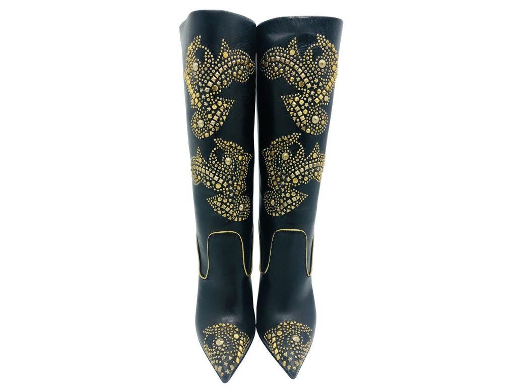 This slip on black boot by Versace has a gorgeous gold stud design on it along the front and the toecap. A 4.7-inch stiletto heel adds to the femininity of this empowering boot. Made entirely out of leather in
