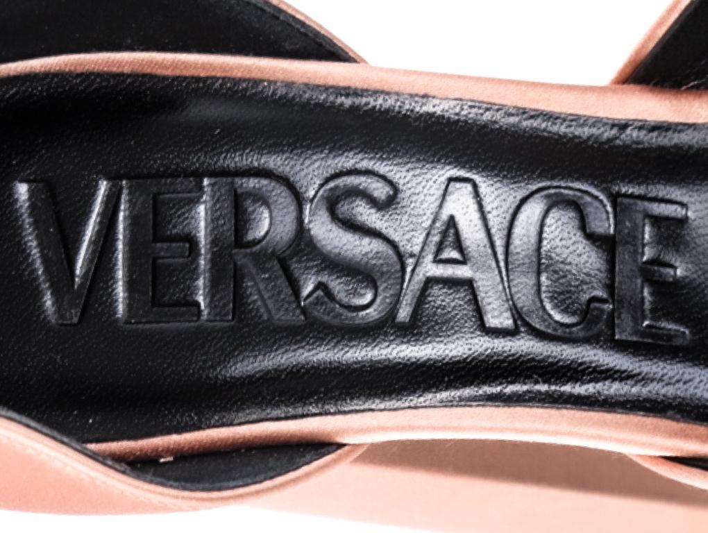 The Medusa Aevitas pumps from Versace are a lesson in statement glamour. They're made from pink satin with towering double platforms and come embellished with crystals and Medusa charms on the ankle straps. Purchased and stored - although not worn,