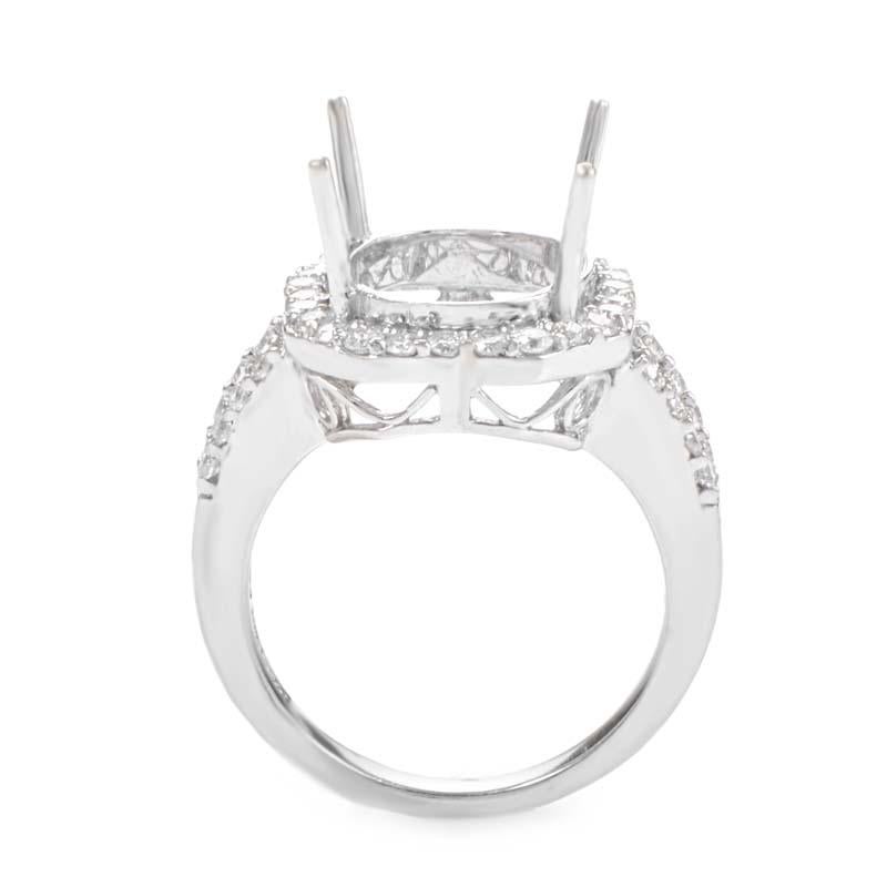 This  mounting is a grand and sophisticated piece for any woman. This ring is made of 18K white gold and boasts shanks and a round bezel set with pristine white diamonds.
