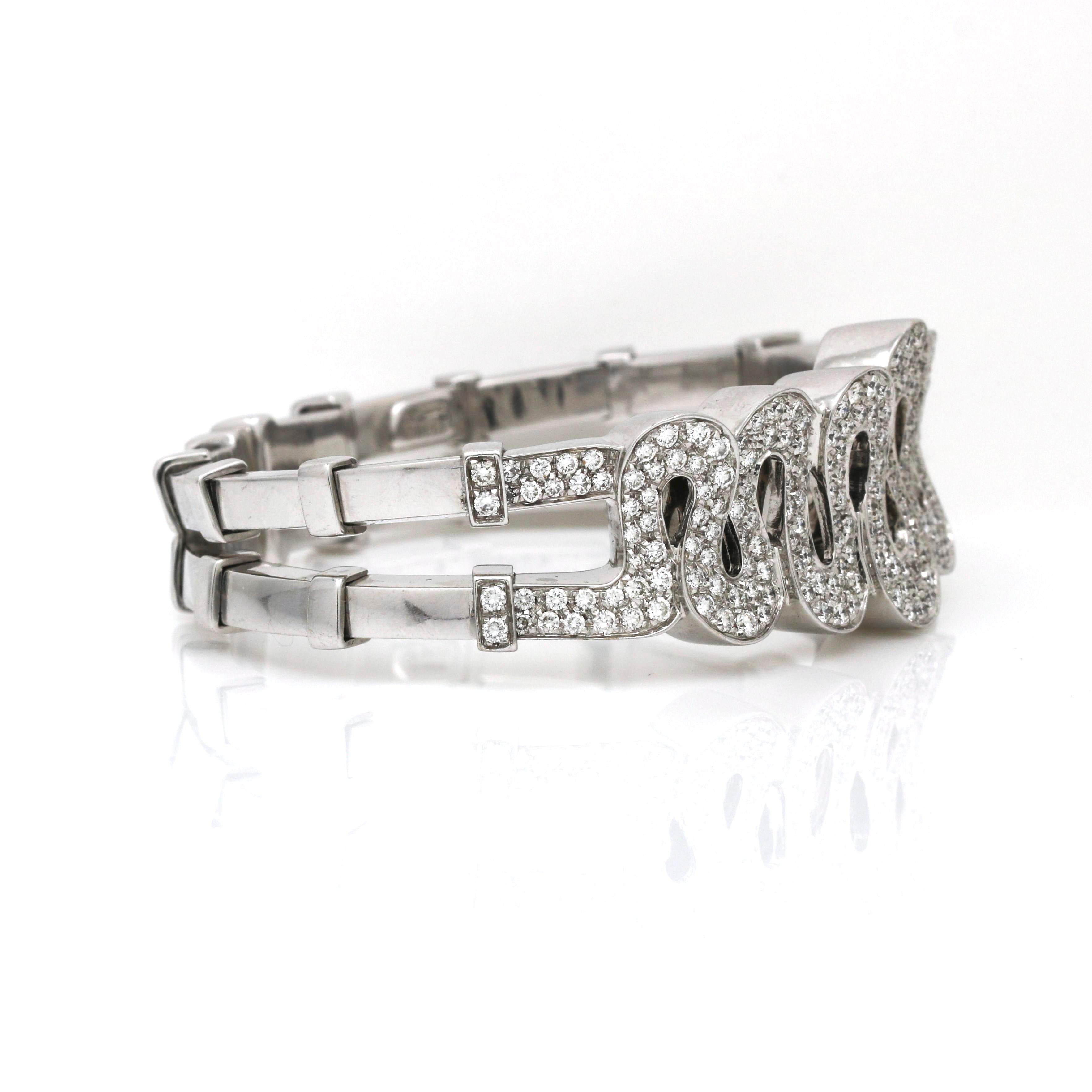 Stunning diamond statement bracelet crafted in 18k white gold in excellent condition. The bangle is signed M, but the trademark number is unclear. It is made in Italy, has superior craftsmanship, and has beautiful, high-quality stones—a very stylish