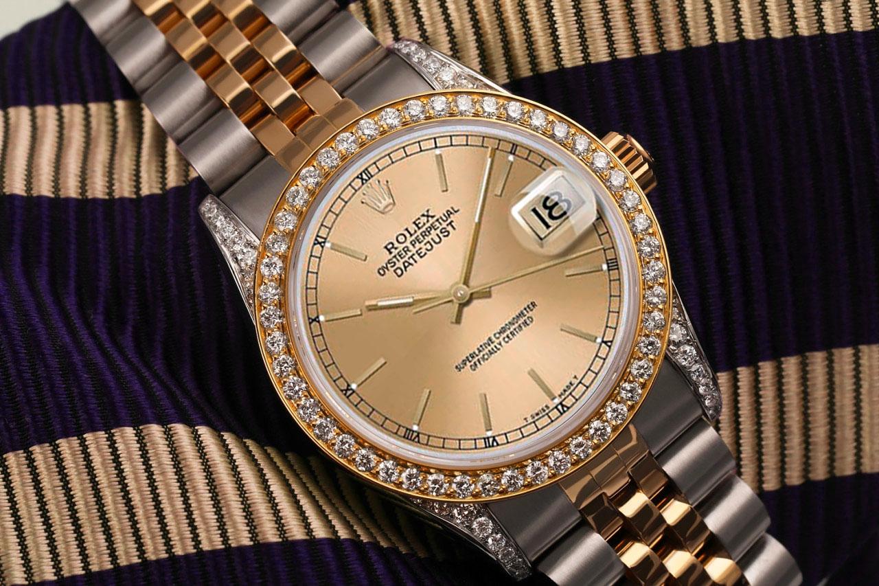 Women's Rolex 31mm Datejust Diamond Bezel & Lugs Champagne Dial Two Tone Watch

 We take great pride in presenting this timepiece, which is in impeccable condition, having undergone professional polishing and servicing to maintain its pristine