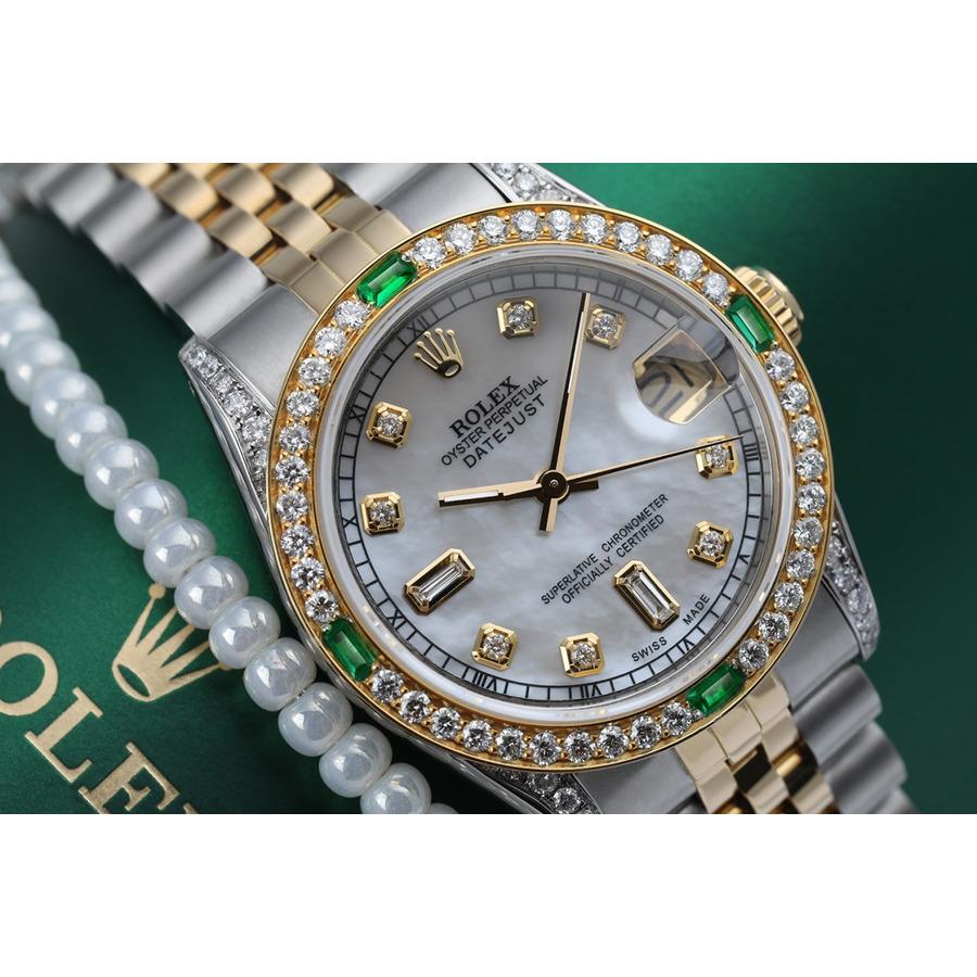 Women's Rolex 31mm Datejust Two Tone Jubilee White MOP Mother of Pearl Dial Diamond Accen Bezel + Lugs + Emerald Watch 68273
This watch is in like new condition. It has been polished, serviced and has no visible scratches or blemishes. All our