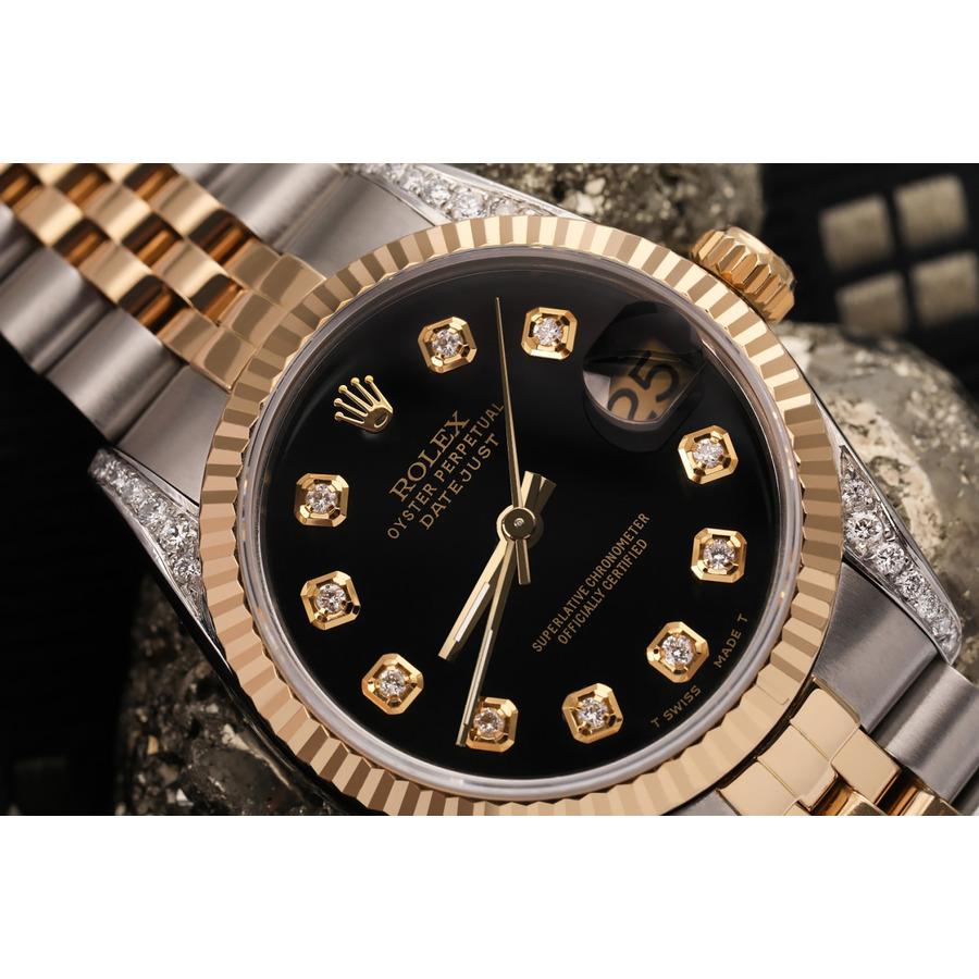 Women's Rolex 31mm Datejust Two Tone Vintage Fluted Bezel With Lugs Black Color Dial with Diamonds Watch 68273
This watch is in like new condition. It has been polished, serviced and has no visible scratches or blemishes. All our watches come with a