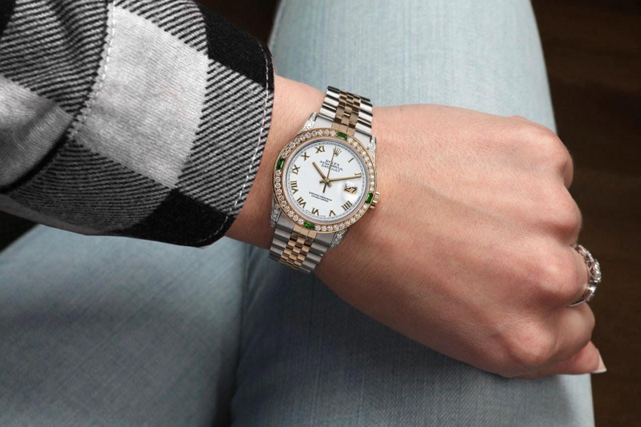 
 We take great pride in presenting this timepiece, which is in impeccable condition, having undergone professional polishing and servicing to maintain its pristine appearance. The watch features aftermarket diamonds (non-Rolex), and there are no