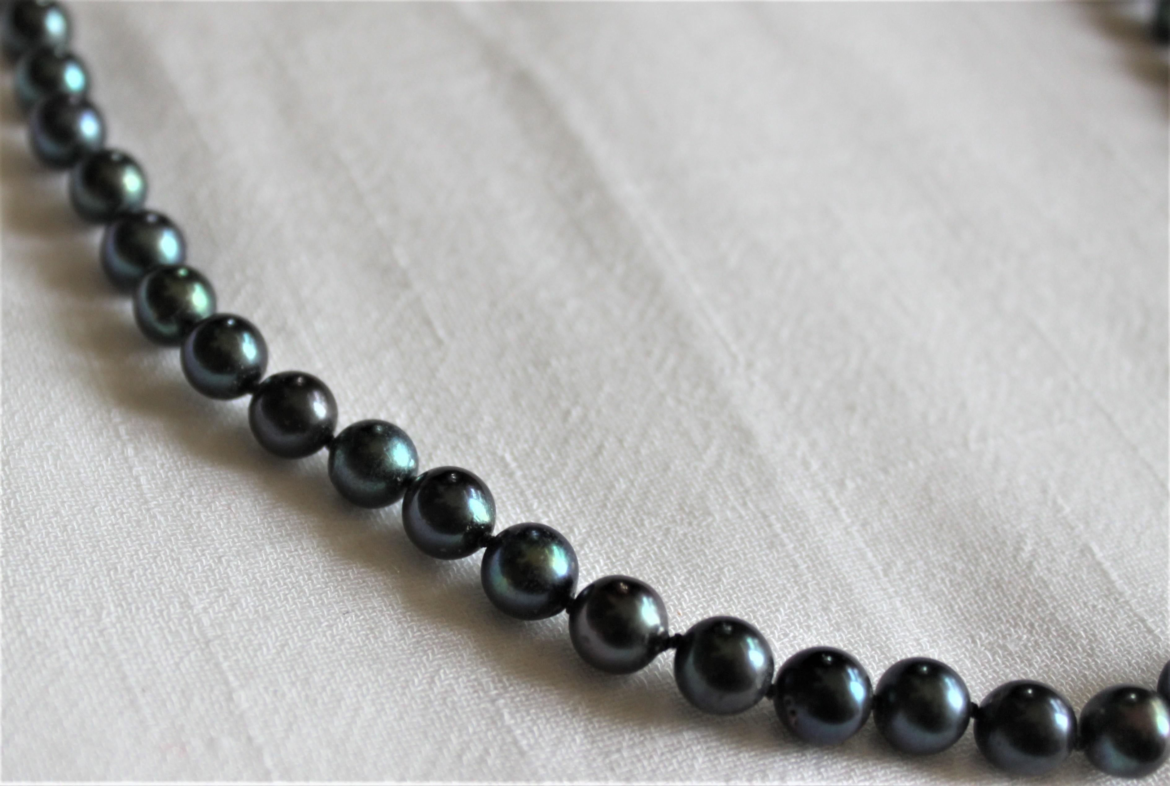 Machine-Made Women's Tahitian Black Pearl Necklace with a 14 Karat Gold Ball Clasp For Sale