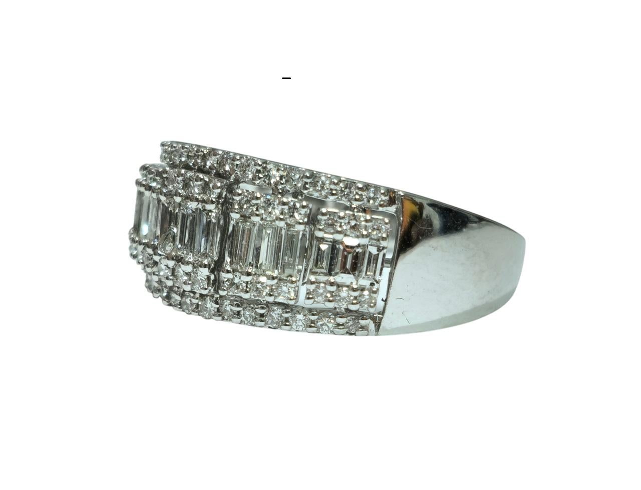 Crafted from 14k white gold, this stunning ring boasts a total of 1.35 carats of diamonds, featuring a combination of round brilliant and baguette cuts. The diamonds exhibit VS clarity and G color, ensuring exceptional brilliance. With its exquisite