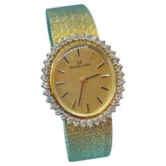 Montre de femme en or 18kt et diamants naturels "Universal Geneve" à remontage manuel