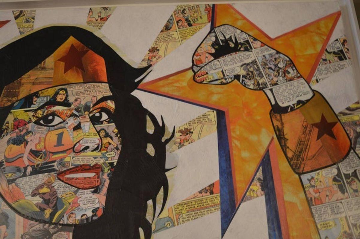 Wonder woman blast is a pop Art piece by Anabel Ruiz. Her art is mixed media with paint on Wonder Woman comics. Signed in the bottom left corner.