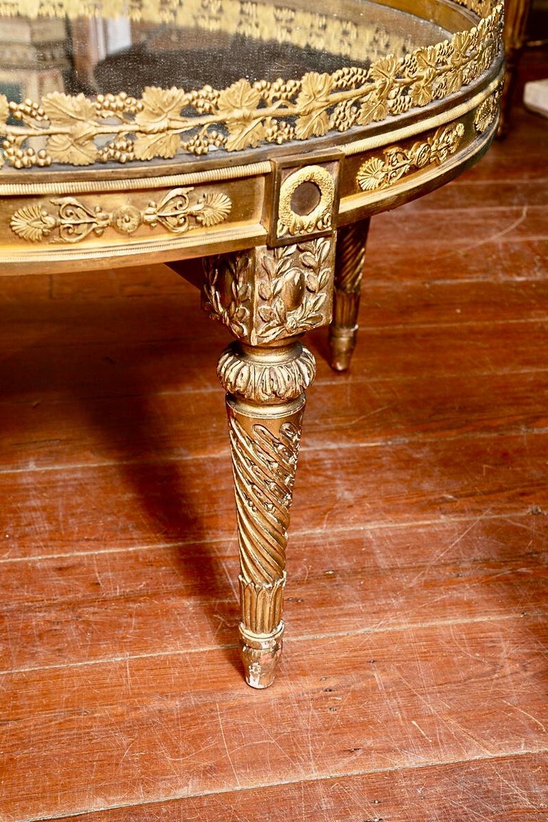 This is an incredible bronze Dore’ coffee table with very elaborate design and Bronze chasing.It is Mercury Bronze Dore’ which is a completely lost art. Many bronziers fell ill from the fumes and it was outlawed. They went to plating instead and the