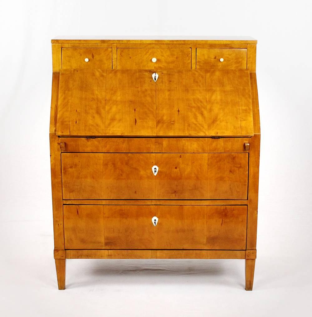 • 19th century Biedermeier period secretary, circa 1820-1830
• Birch veneered
• Two spacious pushes in the base part
• Nice inner life with mirror and nine small pushes
• Restored state
• French shellac hand polish
• Measures: Height 119 cm,
