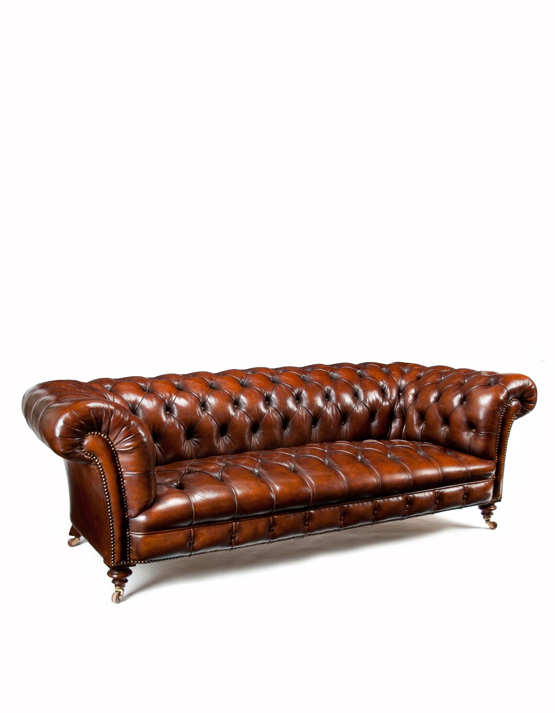 An extremely well-drawn 19th century Victorian walnut deep buttoned leather upholstered Chesterfield stamped by the famous makers James Jas Shoolbred & Co. London.
Along with Howard and Sons Jas Shoolbred are two of the most sought-after names in