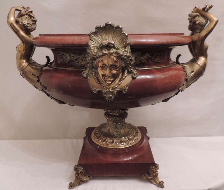 An extremely fine 19th century doré bronze and rouge marble monumental figural centerpiece with magnificent detail to the bronze and rouge marble.