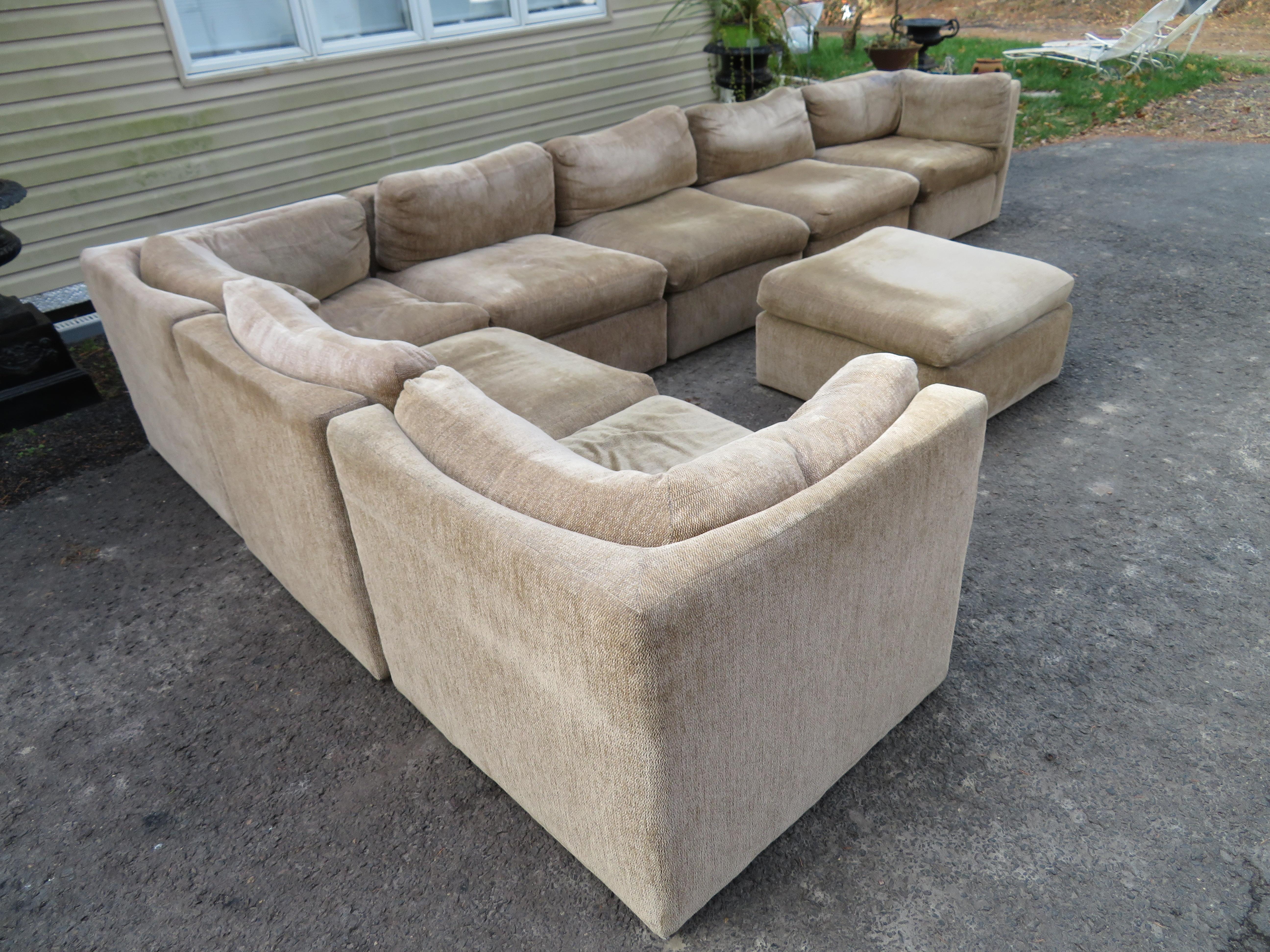 Wonderful Milo Baughman 8-piece sectional sofa with unusual curved seat backs. This sofa looks as though it was reupholstered maybe 10-15 years ago and the fabric still looks good-some minor spots. This sectional consists of 3 corners, 4 armless