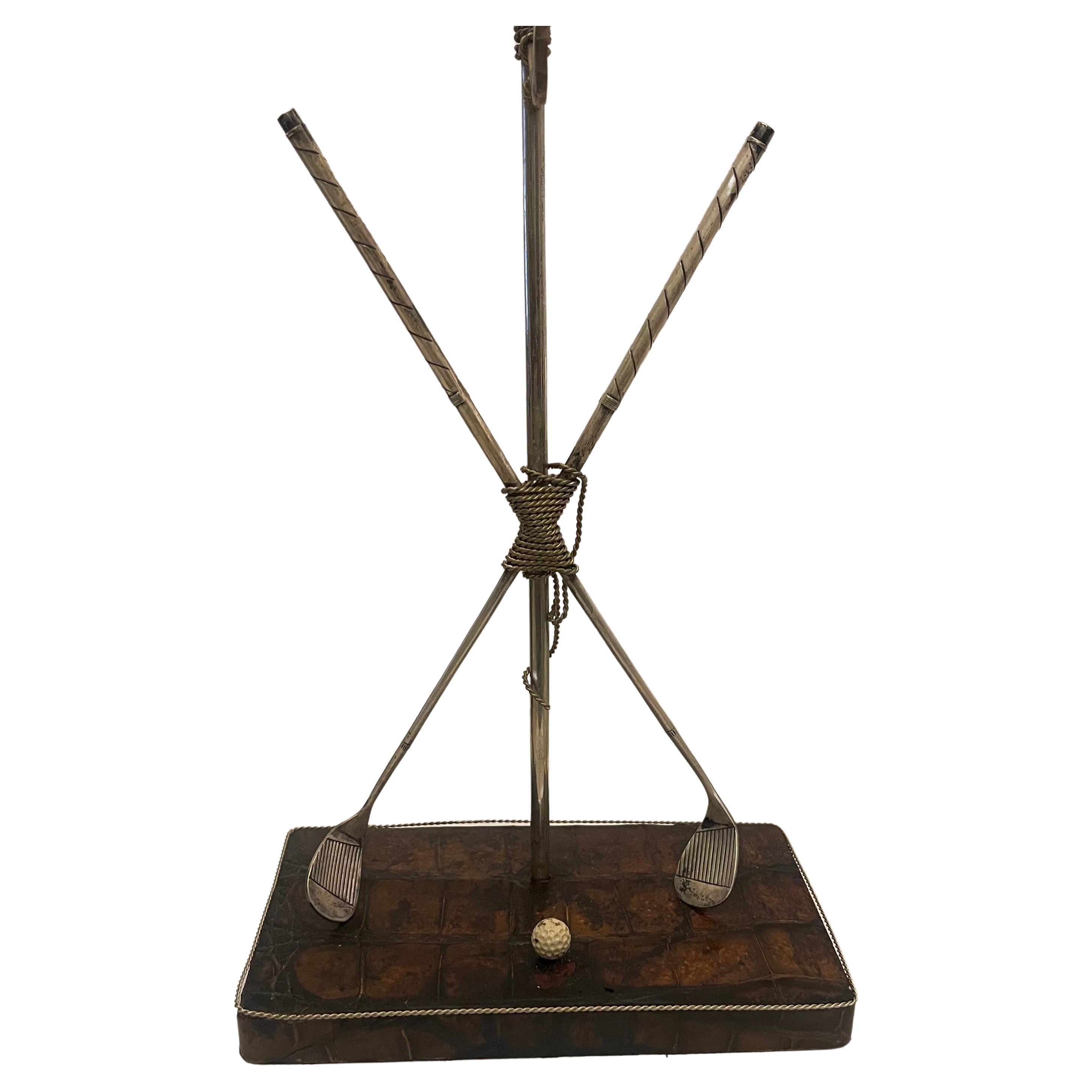 A Wonderful Alvin Silver Plated Pocket Watch Stand Made Up Of Cross Golf Clubs Against A Flag Pole Resting On A Crocodile Base
Stamped Alvin On The Bottom Of Each Club.