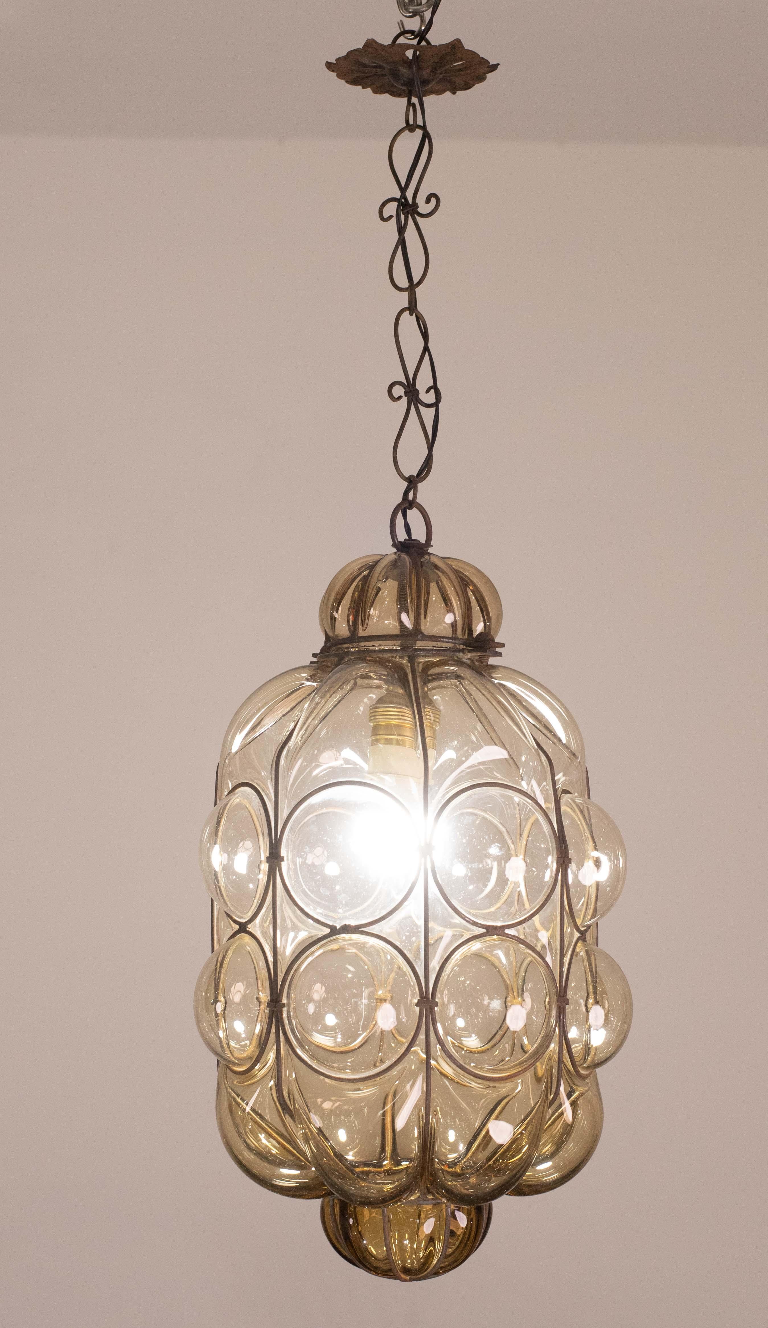 A beautiful light for hallways, entryways and living rooms, this hand-blown glass lantern is attributed to Seguso. The glass is a soft amber clour. As always, these beautiful lanterns create their own magic and show incredible craftsmanship.

The