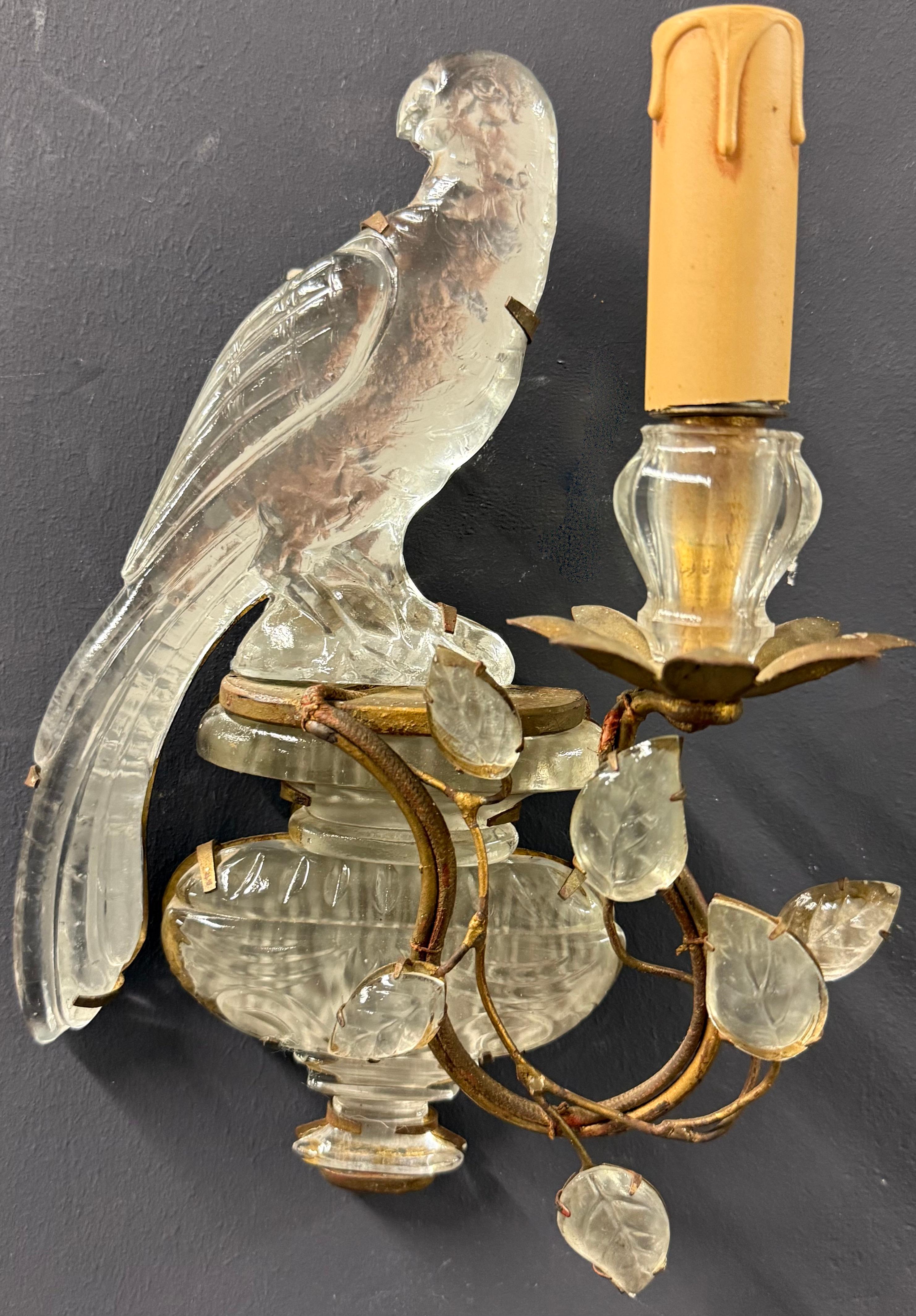 wonderful pair of signed maison bagues parrot sconces.