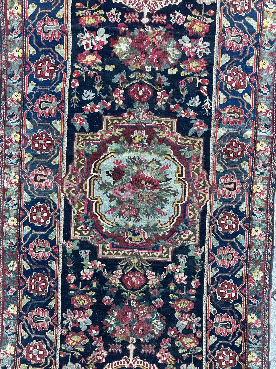 Very beautiful early 20th century Bakhtiar rug with nice floral design in style of the savonnerie rugs and beautiful colours with a dark blue background with three pretty medallions adorned with the flowers in hues of the red, green, pink, blue,