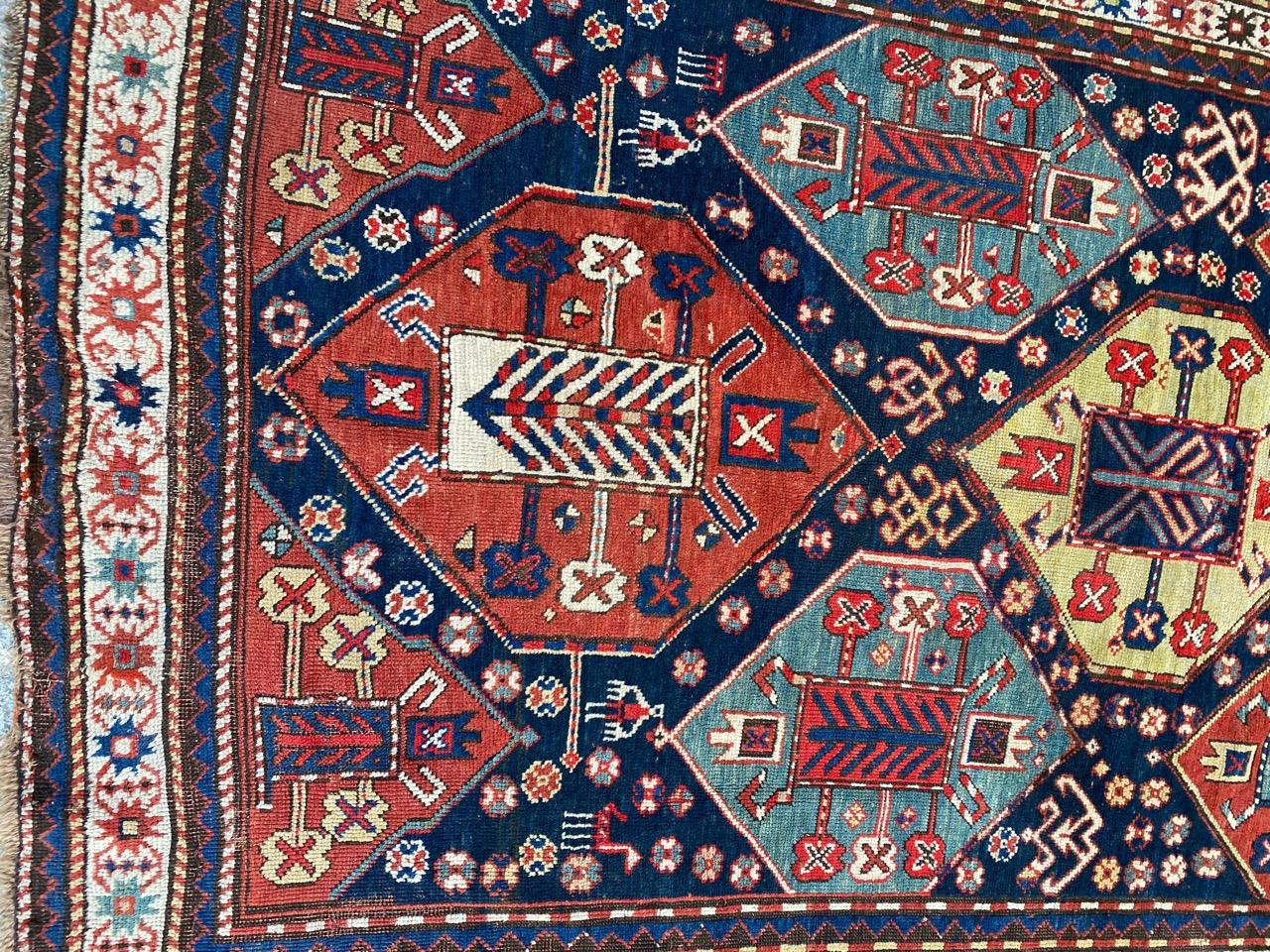Very beautiful long Kazak rug with a beautiful geometrical design and nice natural colors, entirely hand knotted with wool velvet on wool foundation.