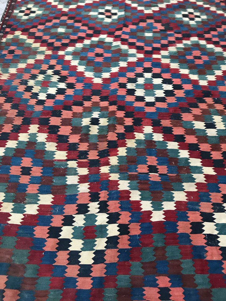 Very beautiful large Kilim, late 19th century with a wonderful geometrical design and nice natural colors, with blue, red, pink, brown and green. Entirely handwoven with wool on wool foundation.