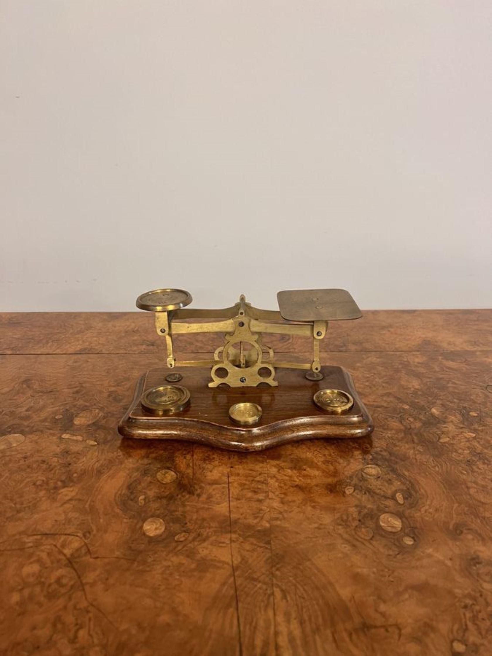 Wonderful antique Edwardian postal scales & weights, having a lovely pair of antique Victorian brass postal scales with brass weights mounted on a wooden shaped base.

D. 1910 