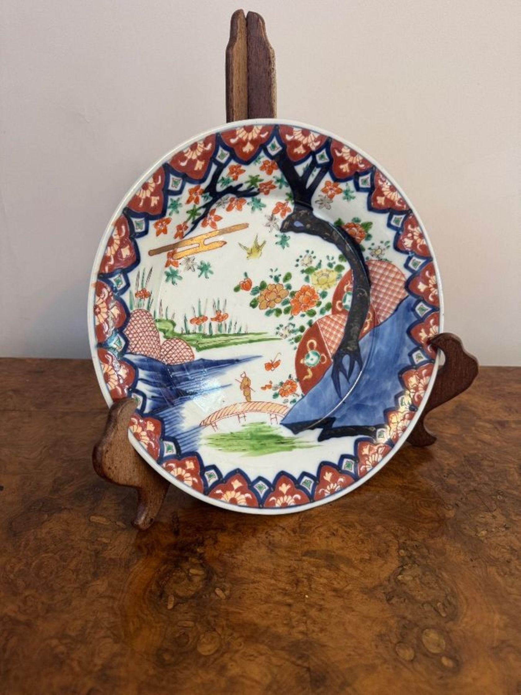 Wonderful antique Japanese imari plate, having a quality antique Japanese imari plate decorated with a landscape scene with a lake, bridge, birds, flowers and trees in vibrant red, blue, green, gold and white colours.

D. 1900