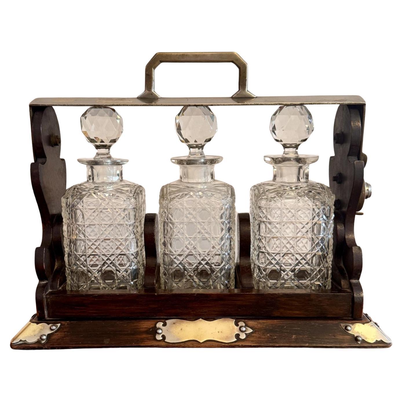 Wonderful antique oak three bottle tantalus