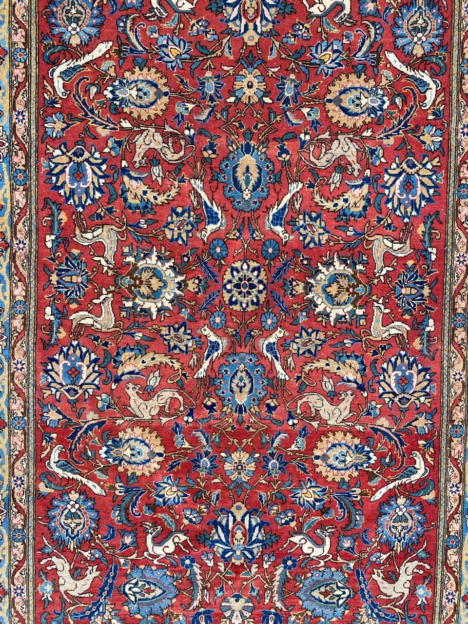 Very beautiful mid-20th century rug with nice garden design with flowers and animals, and beautiful natural colors with red, blue, beige and yellow, entirely and finely hand knotted with wool velvet on cotton foundation.