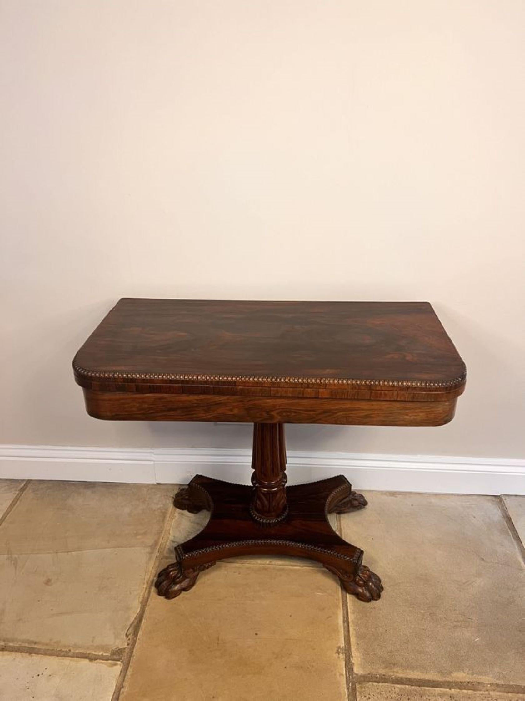 Wonderful antique Regency quality rosewood card table, having a quality rosewood fold over top with a carved edge opening to reveal a baize interior, supported by a reeded carved solid rosewood pedestal column, standing on a platform with a carved