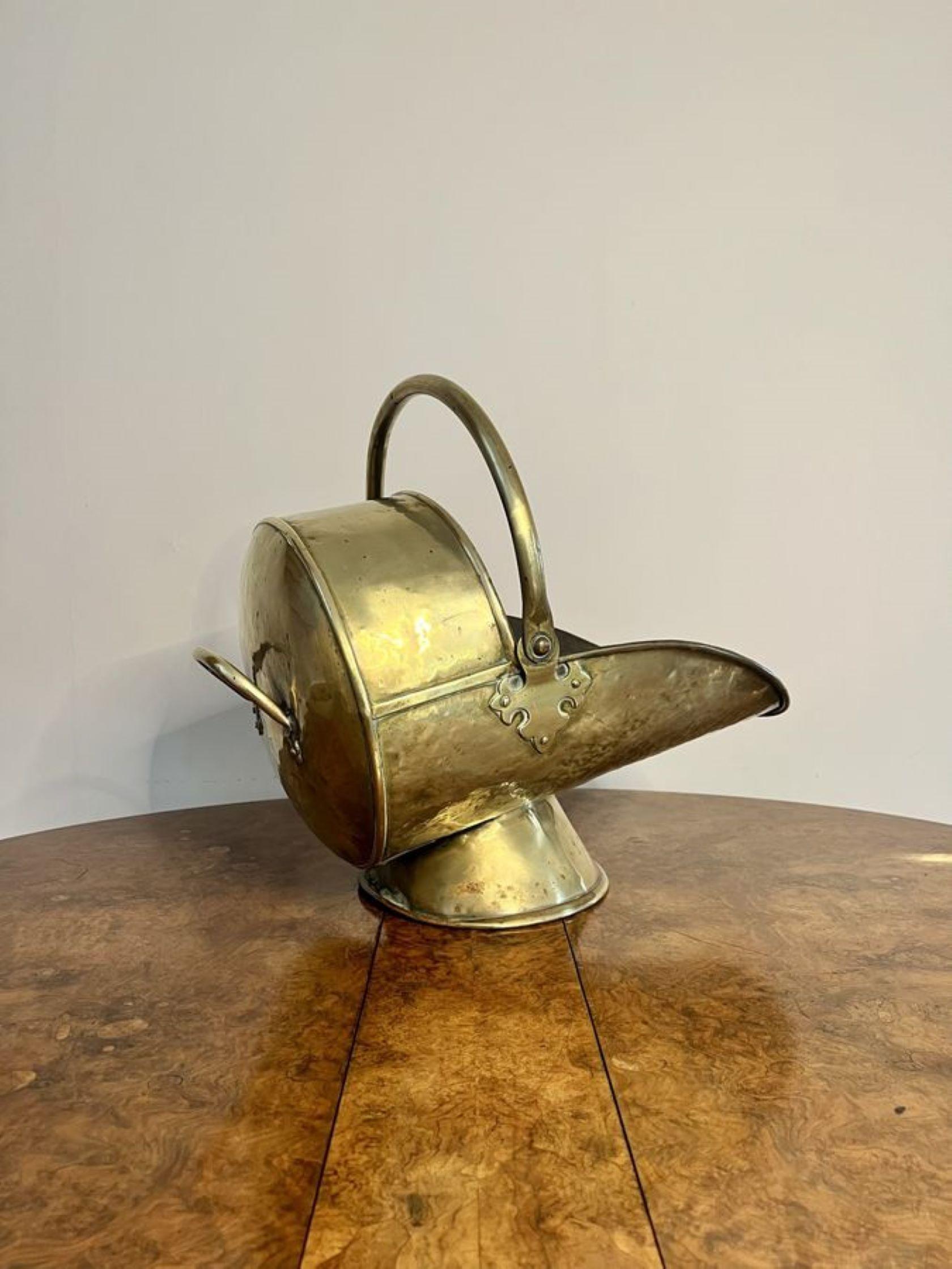 Wonderful antique Victorian brass coal scuttle and shovel having a quality brass coal scuttle with a swing handle to the top, a carrying handle to the back raised on a circular base. 

D. 1880
