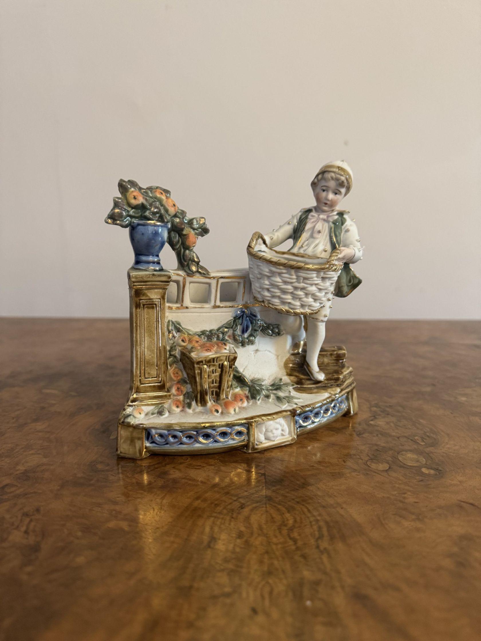 Wonderful antique Victorian quality porcelain clock set, having a quality mantle clock with an eight day movement with a pair of side figures, decorated with children playing and picking flowers in stunning blue, green, yellow, white and gold