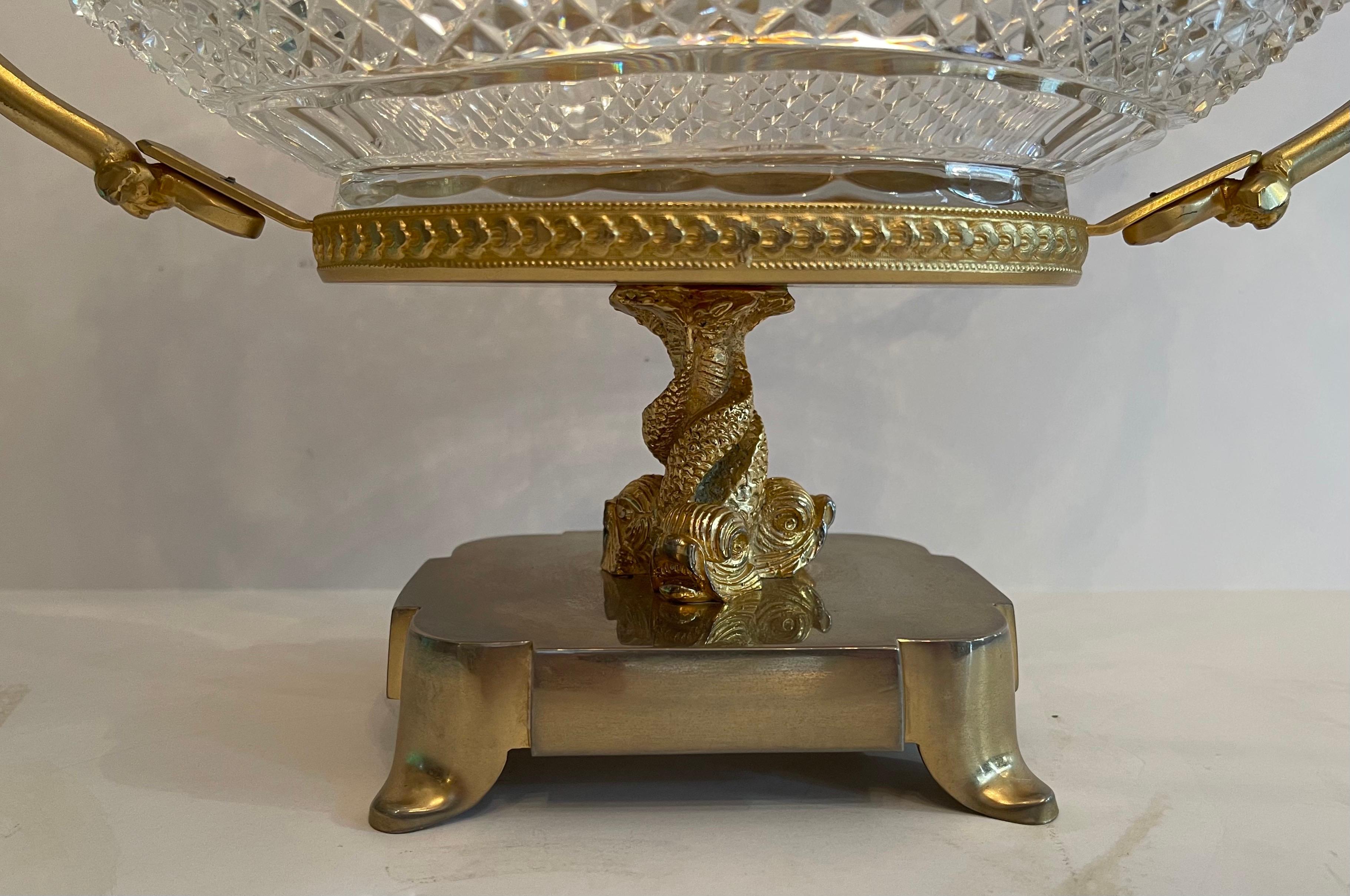 A Wonderful Baccarat style French cherub / putti gilt bronze ormolu centerpiece with faceted crystal insert bowl built up on intertwined Dolphin base.