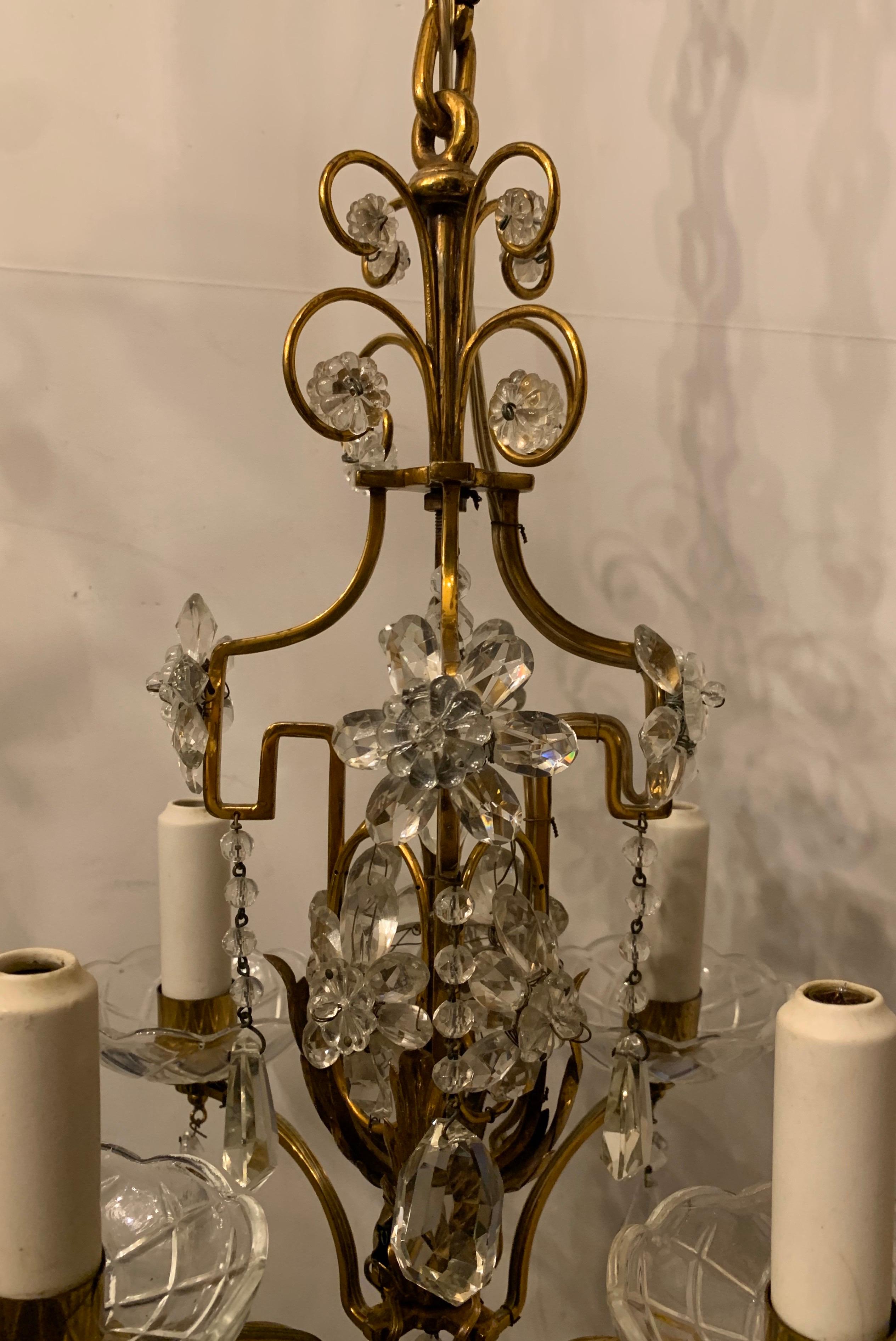 A wonderful Baguès style French brass & crystal beaded petite chandelier four-light fixture with a beautiful crown and surrounded by crystal flowers.
The perfect piece for any small space.