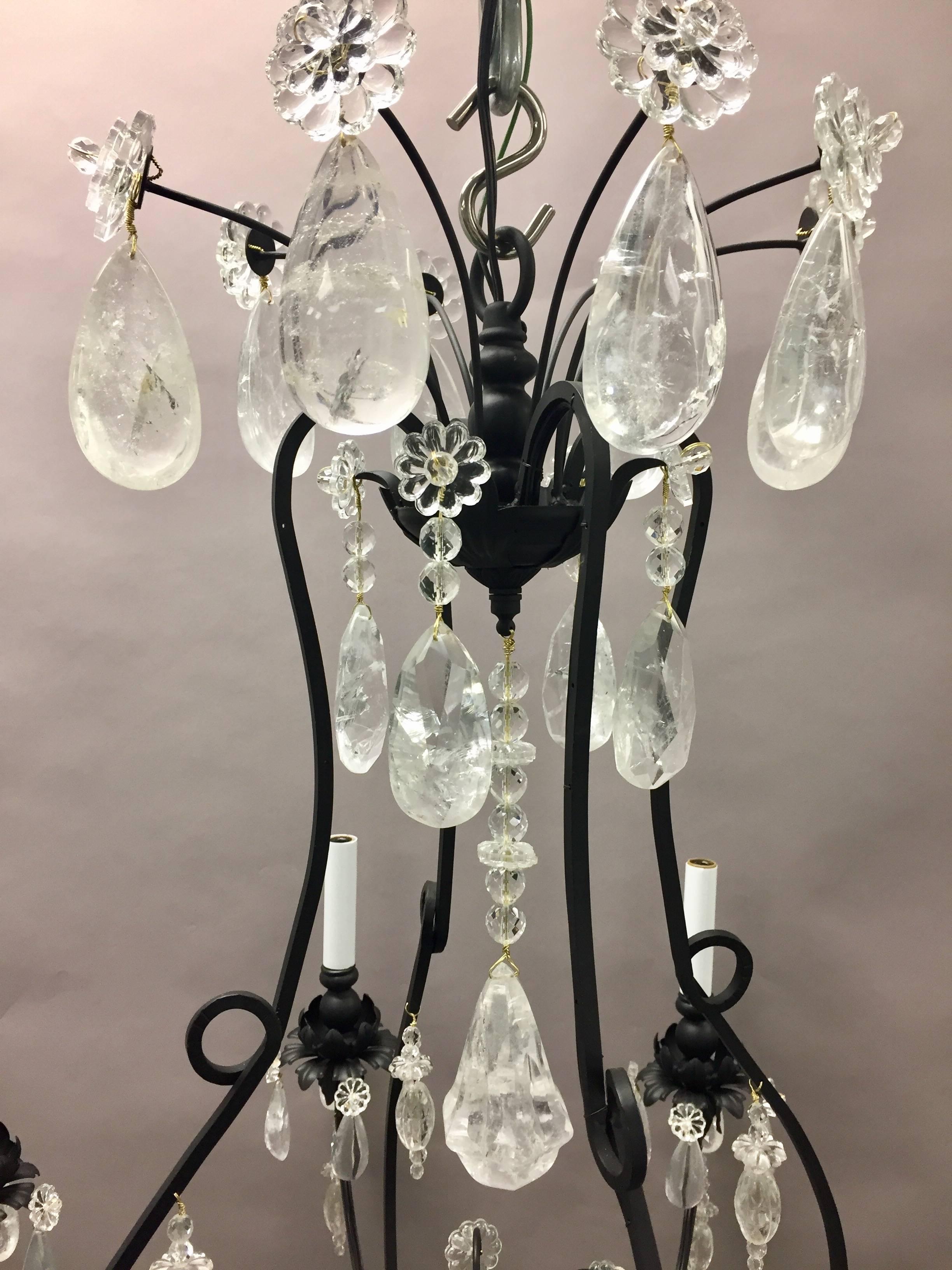 A wonderful Baguès style French rock crystal, black iron gilt chandelier with eight lights.
Size: H 35 inches x W 32.5 inches.
  