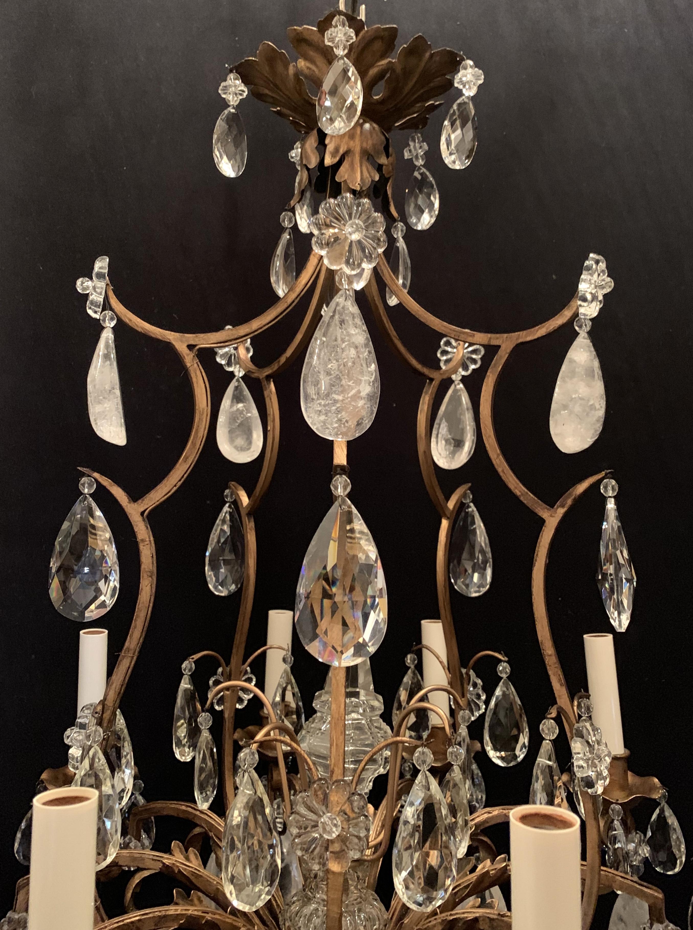 A wonderful Baguès French rock crystal and gold gilt iron chandelier ten-light chandelier
completely rewired and ready to install with chain and canopy.