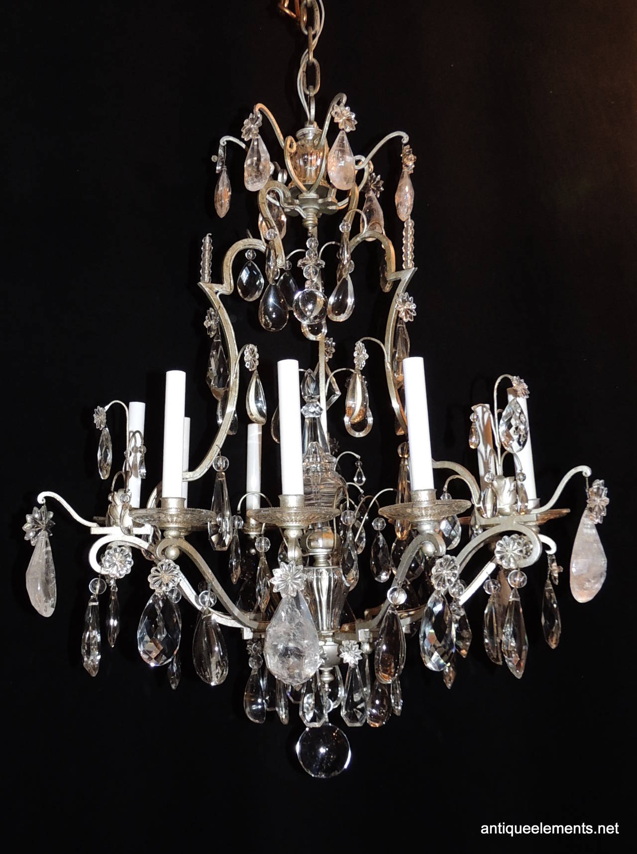 An original Bagues nine-light chandelier with silvered gilt bronze and rock crystal.
The detail of diamond prism, rock crystal and flat back crystal throughout the chandelier capture the light from nine candelabra arms. A wonderful centre crystal