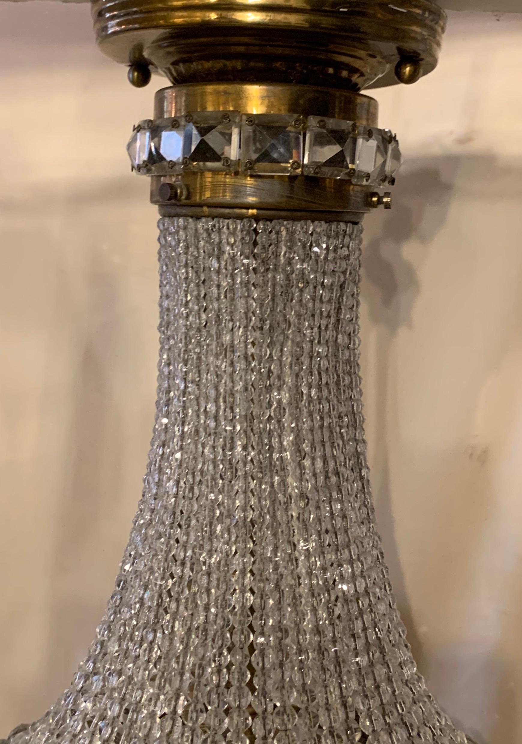 A wonderful beaded crystal and brass basket form flush mount light fixture, rewired with an Edison socket and ready to install with mounting brackets.