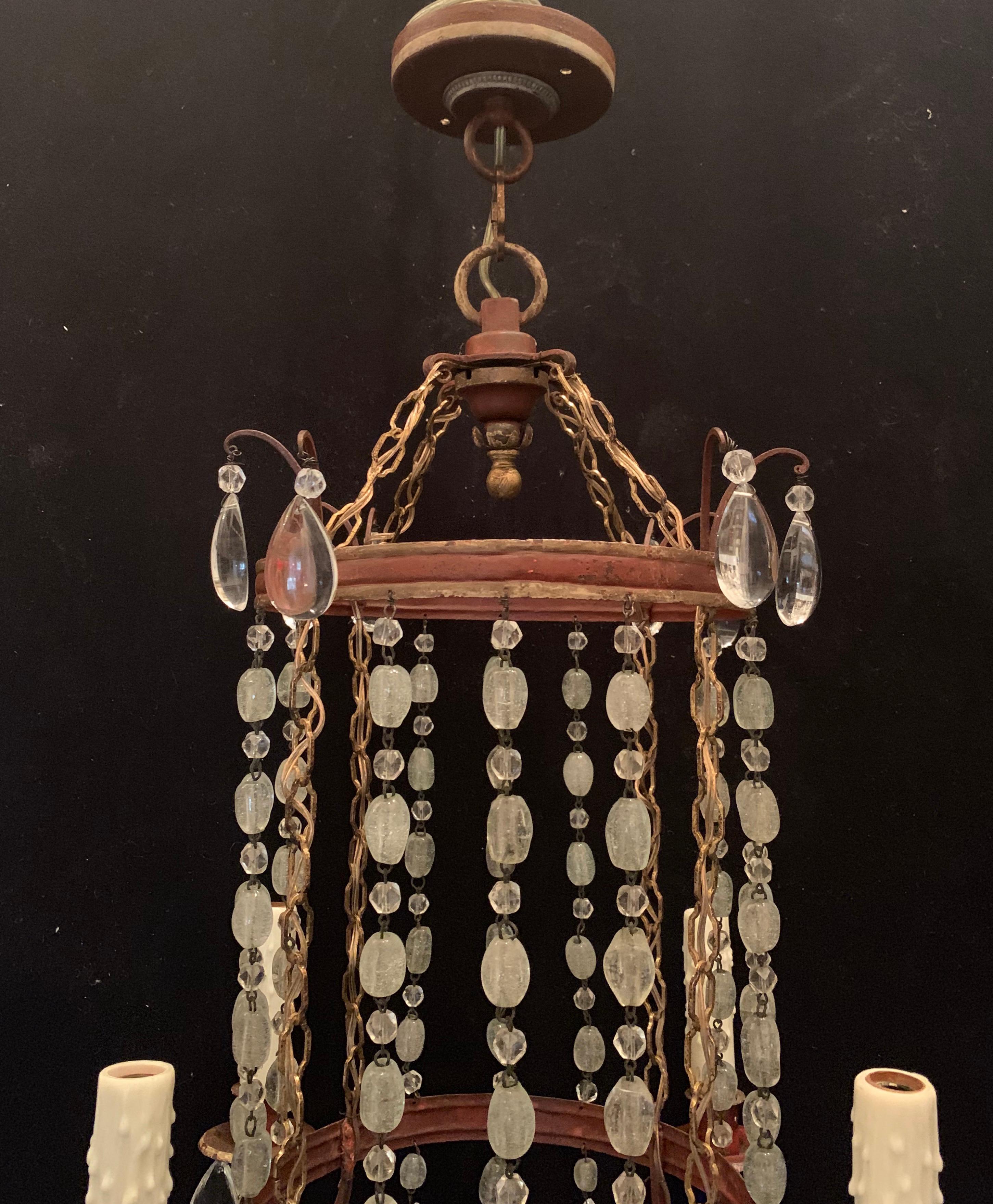 A wonderful beaded crystal drop and red tole with gold gilt pagoda / lantern form pendant chandelier with 4 candelabra lights, completely rewired and ready to install and enjoy in the manner of Baguès.