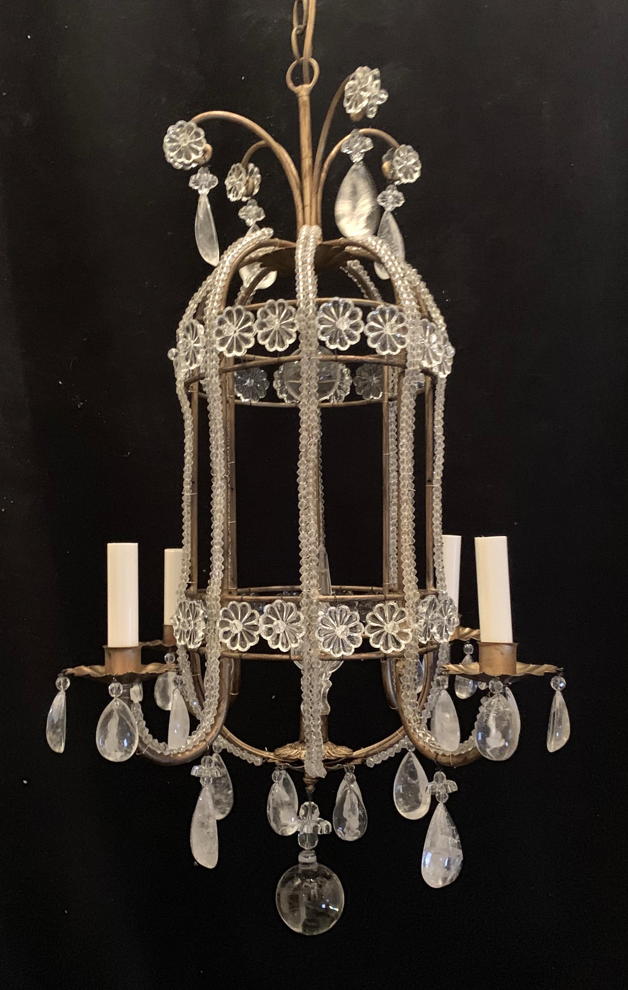 A wonderful beaded Italian Baguès pagoda style rock crystal, gold gilt fixture with crystal flower this chandelier has 4 candelabra lights that have been completely rewired with new sockets.