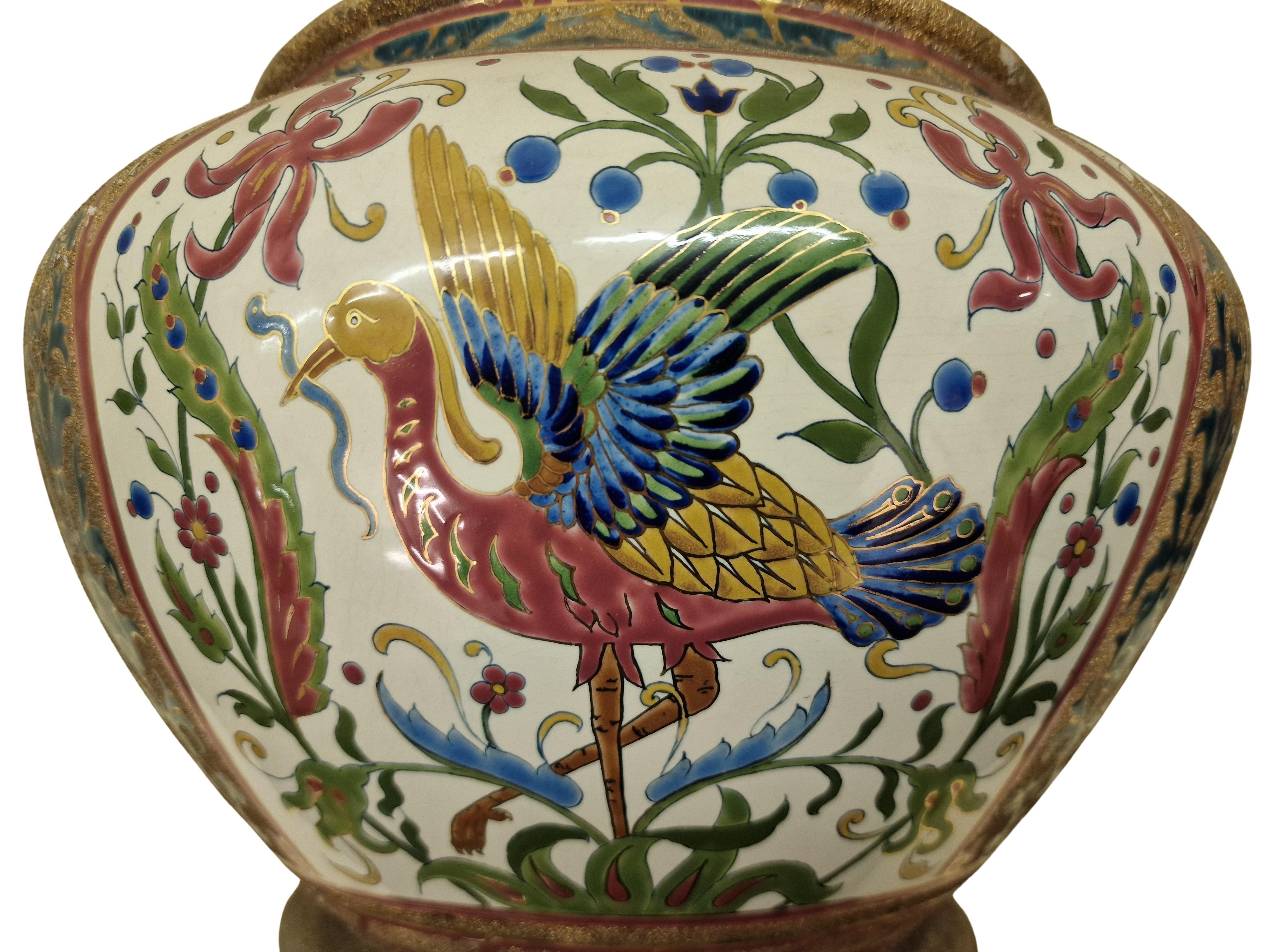 Impressive big size flower pot, made around 1890 till 1900, by the workshop of Znaim in the Czech Republic. A wonderful original Jugendstil / Art Nouveau piece. 

This flower pot is very colorful and shows different kinds of paradise birds with